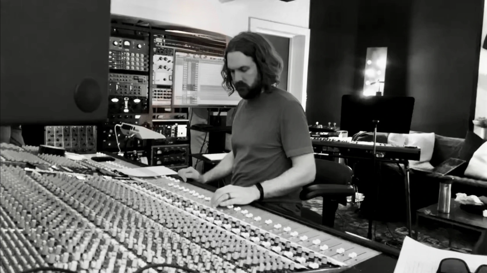 Garrett R. Miller working at a studio mixing console